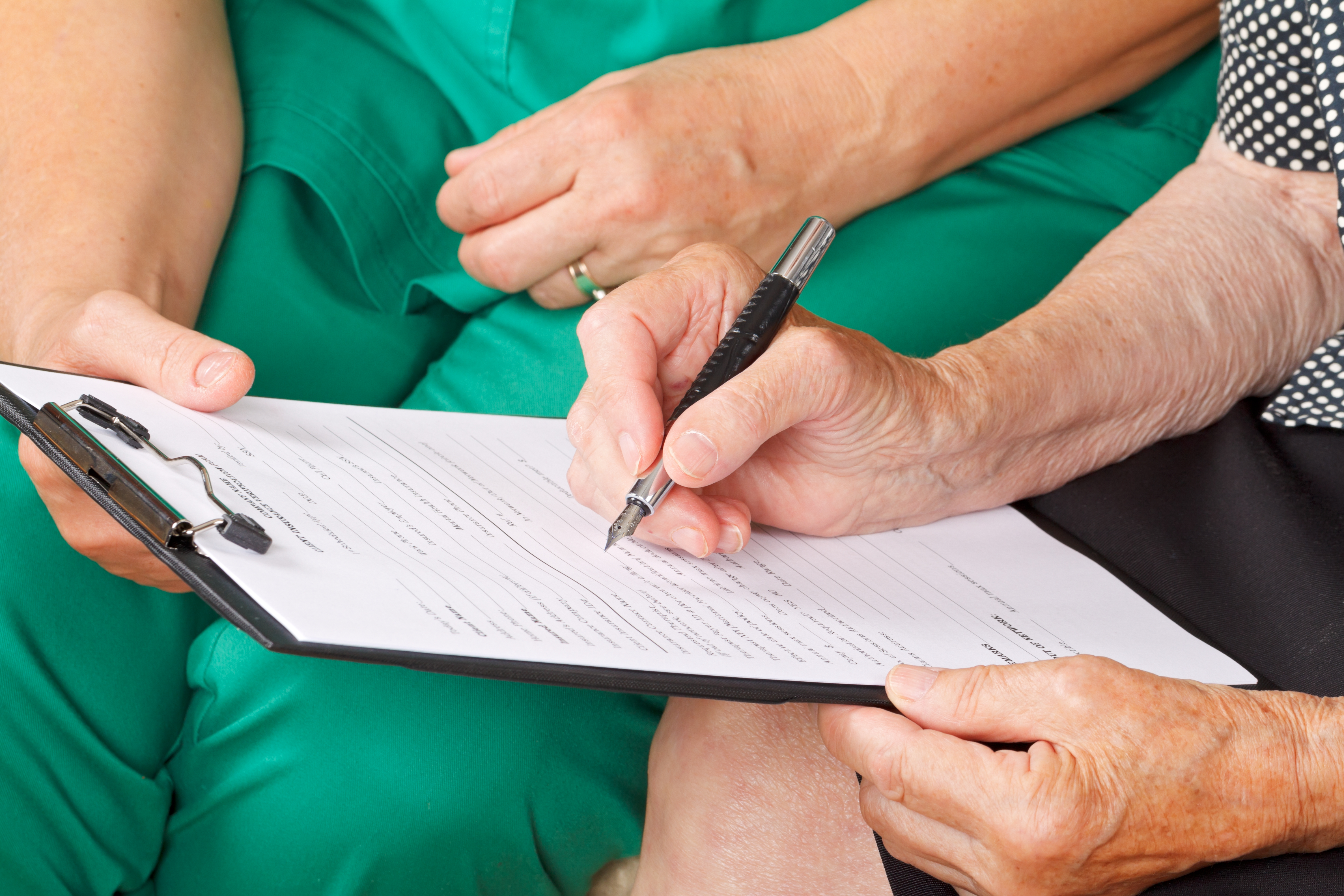 Patient with clipboard filling out a PRO